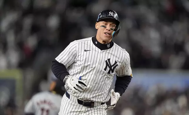 New York Yankees' Aaron Judge runs the bases after hitting a two-run home run against the Cleveland Guardians during the seventh inning in Game 2 of the baseball AL Championship Series Tuesday, Oct. 15, 2024, in New York. (AP Photo/Frank Franklin II)