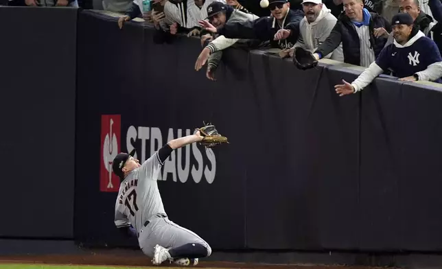 Cleveland Guardians right fielder Will Brennan catches a fly ball by New York Yankees' Giancarlo Stanton during the first inning in Game 2 of the baseball AL Championship Series Tuesday, Oct. 15, 2024, in New York. (AP Photo/Frank Franklin II)