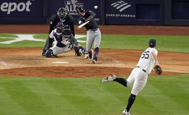 Cleveland Guardians' Brayan Rocchio, center, hits a home run off New York Yankees starting pitcher Carlos Rodón (55) during the sixth inning in Game 1 of the baseball AL Championship Series Monday, Oct. 14, 2024, in New York. (AP Photo/Seth Wenig)