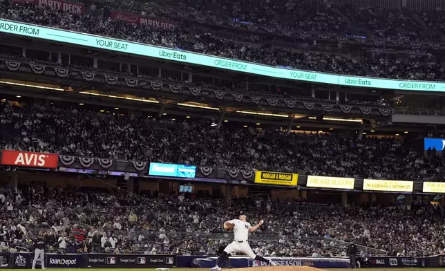 New York Yankees starting pitcher Carlos Rodón throws against the Cleveland Guardians during the second inning in Game 1 of the baseball AL Championship Series Monday, Oct. 14, 2024, in New York. (AP Photo/Godofredo Vásquez )