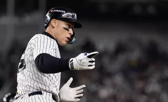 New York Yankees' Aaron Judge celebrates after hitting a two-run home run against the Cleveland Guardians during the seventh inning in Game 2 of the baseball AL Championship Series Tuesday, Oct. 15, 2024, in New York. (AP Photo/Godofredo Vásquez )