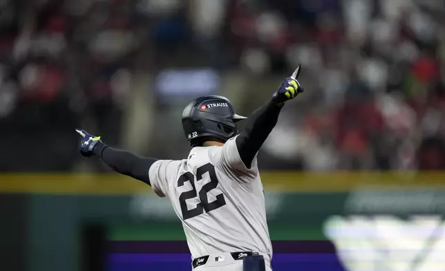 New York Yankees' Juan Soto celebrates after hitting a two-run home run against the Cleveland Guardians during the first inning in Game 4 of the baseball AL Championship Series Friday, Oct. 18, 2024, in Cleveland. (AP Photo/Godofredo A. Vásquez)