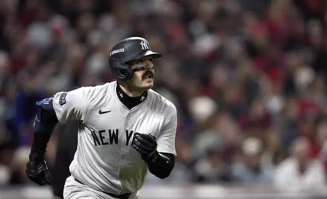 New York Yankees' Austin Wells watches his home run against the Cleveland Guardians during the second inning in Game 4 of the baseball AL Championship Series Friday, Oct. 18, 2024, in Cleveland. (AP Photo/Godofredo A. Vásquez)