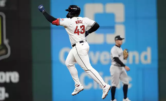 Cleveland Guardians' Jhonkensy Noel (43) celebrates after hitting a two-run home run against the New York Yankees during the ninth inning in Game 3 of the baseball AL Championship Series Thursday, Oct. 17, 2024, in Cleveland. (AP Photo/Godofredo Vásquez )