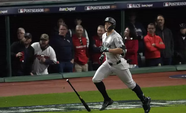 New York Yankees' Giancarlo Stanton watches his home run against the Cleveland Guardians during the eighth inning in Game 3 of the baseball AL Championship Series Thursday, Oct. 17, 2024, in Cleveland.(AP Photo/Sue Ogrocki)