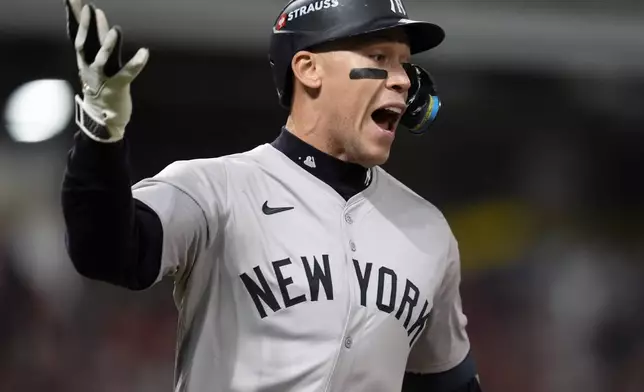 New York Yankees' Aaron Judge celebrates after hitting a two-run home run against the Cleveland Guardians during the eighth inning in Game 3 of the baseball AL Championship Series Thursday, Oct. 17, 2024, in Cleveland.(AP Photo/Godofredo Vásquez )