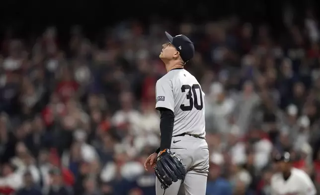 New York Yankees pitcher Luke Weaver watches a two-run home by Cleveland Guardians' Jhonkensy Noel during the ninth inning in Game 3 of the baseball AL Championship Series Thursday, Oct. 17, 2024, in Cleveland. (AP Photo/Jeff Roberson)