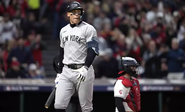 New York Yankees' Aaron Judge walks back to the dugout after striking out against the Cleveland Guardians during the sixth inning in Game 3 of the baseball AL Championship Series Thursday, Oct. 17, 2024, in Cleveland.(AP Photo/Godofredo Vásquez )