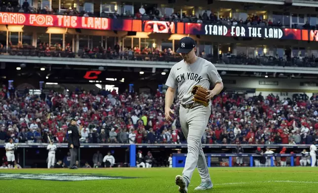 New York Yankees starting pitcher Clarke Schmidt leaves the game during the fifth inning in Game 3 of the baseball AL Championship Series against the Cleveland Guardians Thursday, Oct. 17, 2024, in Cleveland.(AP Photo/Godofredo Vásquez )