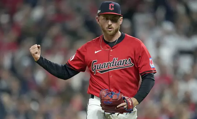 Cleveland Guardians starting pitcher Tanner Bibee reacts after striking out New York Yankees' Aaron Judge during the third inning in Game 5 of the baseball AL Championship Series Saturday, Oct. 19, 2024, in Cleveland. (AP Photo/Sue Ogrocki)