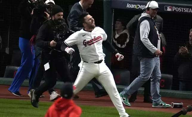 Cleveland Guardians' David Fry celebrates after hitting a game-winning two-run home run against the New York Yankees during the 10th inning in Game 3 of the baseball AL Championship Series Thursday, Oct. 17, 2024, in Cleveland. The Guardians won 7-5. (AP Photo/Sue Ogrocki)