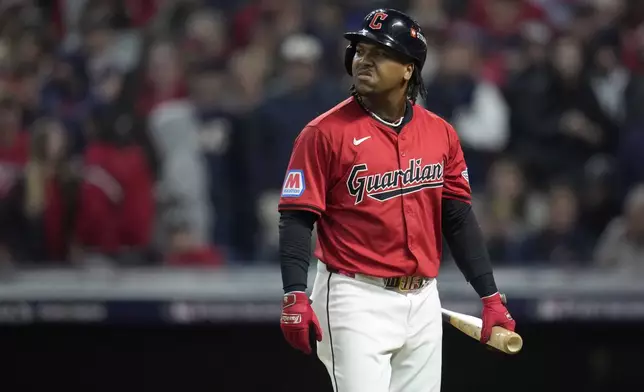 Cleveland Guardians' José Ramírez walks back to the dugout after striking out against the New York Yankees during the eighth inning in Game 5 of the baseball AL Championship Series Saturday, Oct. 19, 2024, in Cleveland. (AP Photo/Sue Ogrocki)