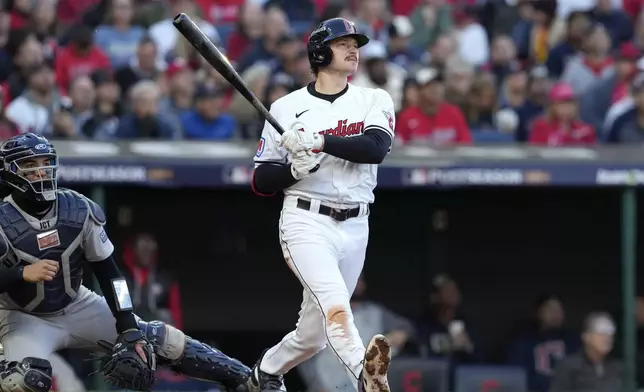 Cleveland Guardians' Kyle Manzardo, right, watches his two-run home run along with New York Yankees catcher Jose Trevino during the third inning in Game 3 of the baseball AL Championship Series Thursday, Oct. 17, 2024, in Cleveland.(AP Photo/Godofredo Vásquez )