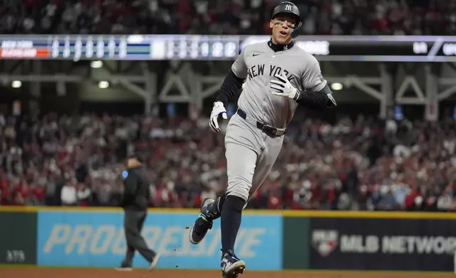 New York Yankees' Aaron Judge runs the bases after hitting a two-run home against the Cleveland Guardians during the eighth inning in Game 3 of the baseball AL Championship Series Thursday, Oct. 17, 2024, in Cleveland.(AP Photo/Jeff Roberson)