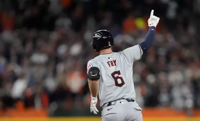 Cleveland Guardians' David Fry celebrates after hitting a two-run home run in the seventh inning during Game 4 of a baseball American League Division Series against the Detroit Tigers, Thursday, Oct. 10, 2024, in Detroit. (AP Photo/Paul Sancya)