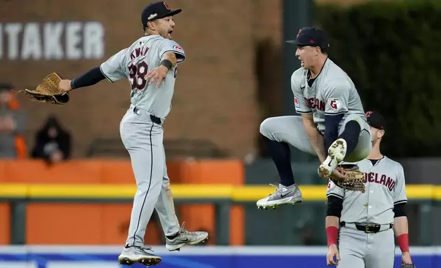 Cleveland Guardians' Steven Kwan (38) celebrates with teammate Will Brennan, right, at the end of Game 4 of a baseball American League Division Series against the Detroit Tigers, Thursday, Oct. 10, 2024, in Detroit. The Guardians won 5-4. (AP Photo/Paul Sancya)