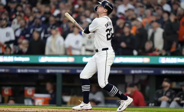 Detroit Tigers' Trey Sweeney hits an RBI sacrifice fly in the second inning during Game 4 of a baseball American League Division Series against the Cleveland Guardians, Thursday, Oct. 10, 2024, in Detroit. (AP Photo/Carlos Osorio)