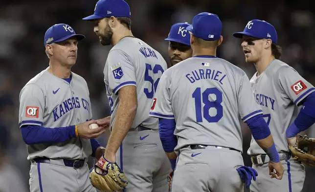 Kansas City Royals pitcher Michael Wacha (52) is relieved by Kansas City Royals manager Matt Quatraro (33) during the fifth inning of Game 1 of the American League baseball division series against the New York Yankees, Saturday, Oct. 5, 2024, in New York.