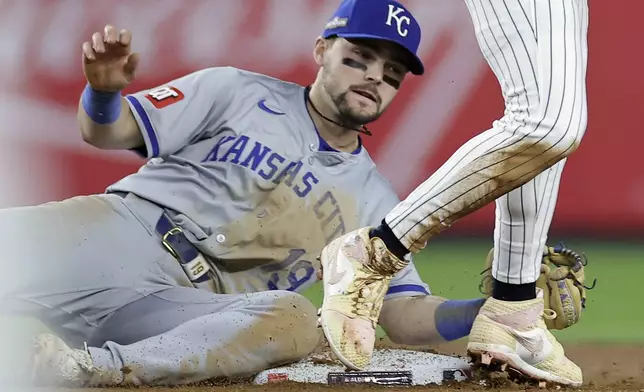 Kansas City Royals second base Michael Massey (19) can't make the tag on New York Yankees' Jazz Chisholm Jr. who stole second base during the seventh inning of Game 1 of the American League baseball division series, Saturday, Oct. 5, 2024, in New York. (AP Photo/Adam Hunger)