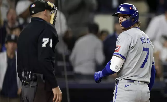 Kansas City Royals' Bobby Witt Jr. (7) argues with home plate umpire Adam Hamari (78) after being called out on strikes during the ninth inning of Game 1 of the American League baseball division series against the New York Yankees, Saturday, Oct. 5, 2024, in New York. (AP Photo/Adam Hunger)