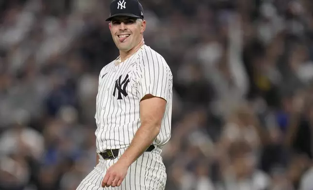 New York Yankees pitcher Carlos Rodón (55) reacts after striking out the batter during the first inning of Game 2 of the American League baseball playoff series against the Kansas City Royals, Monday, Oct. 7, 2024, in New York. (AP Photo/Seth Wenig)