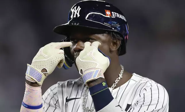 New York Yankees third base Jazz Chisholm Jr. reacts after a base hit against the Kansas City Royals during the seventh inning of Game 1 of the American League baseball division series, Saturday, Oct. 5, 2024, in New York. (AP Photo/Adam Hunger)