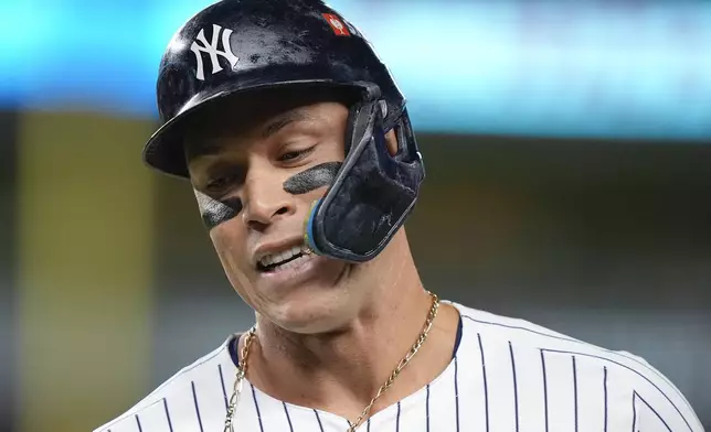 New York Yankees outfielder Aaron Judge reacts after flying out against the Kansas City Royals during the third inning of Game 2 of the American League baseball playoff series, Monday, Oct. 7, 2024, in New York. (AP Photo/Frank Franklin II)