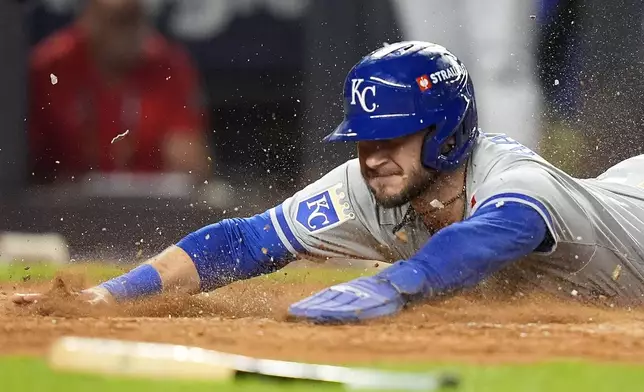 Kansas City Royals Garrett Hampson (2) scores on a hit against the New York Yankees during the fourth inning of Game 2 of the American League baseball playoff series, Monday, Oct. 7, 2024, in New York. (AP Photo/Frank Franklin II)