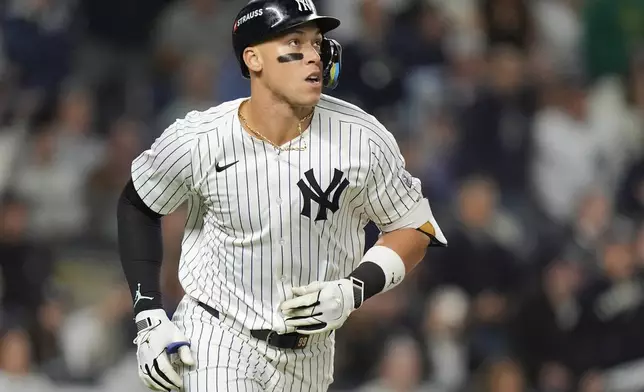 New York Yankees outfielder Aaron Judge watches his fly ball as he heads down the baseline during the third inning of Game 2 of the American League baseball playoff series against the Kansas City Royals, Monday, Oct. 7, 2024, in New York. (AP Photo/Frank Franklin II)