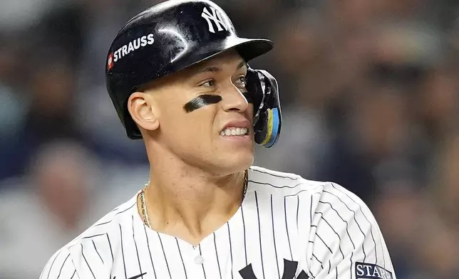 New York Yankees' Aaron Judge reacts as he takes a walk against the Kansas City Royals during the fifth inning of Game 2 of the American League baseball playoff series, Monday, Oct. 7, 2024, in New York. (AP Photo/Frank Franklin II)