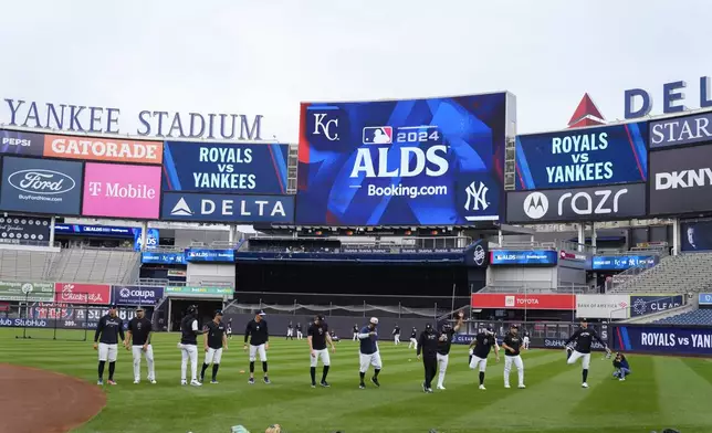 The New York Yankees warm up during a baseball workout, Friday, Oct 4, 2024, in New York, in preparation for the American League Division Series against the Kansas City Royals. (AP Photo/Frank Franklin II)