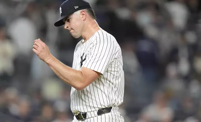 New York Yankees pitcher Carlos Rodón reacts as he walks off the field during the fourth inning of Game 2 of the American League baseball playoff series against the Kansas City Royals, Monday, Oct. 7, 2024, in New York. (AP Photo/Frank Franklin II)