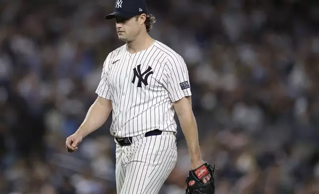 New York Yankees pitcher Gerrit Cole walks off the mound during the sixth inning of Game 1 of the American League baseball division series against the Kansas City Royals, Saturday, Oct. 5, 2024, in New York. (AP Photo/Adam Hunger)