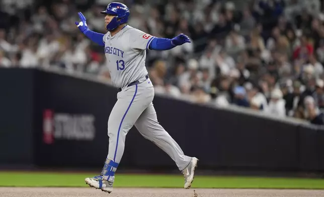 Kansas City Royals' Salvador Perez (13) reacts after hitting a solo home run against the New York Yankees during the fourth inning of Game 2 of the American League baseball playoff series, Monday, Oct. 7, 2024, in New York. (AP Photo/Seth Wenig)