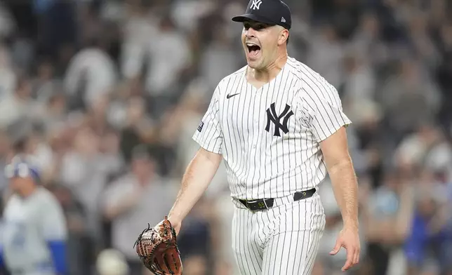 New York Yankees pitcher Carlos Rodón reacts after striking out the Kansas City Royals to end the top of the first inning of Game 2 of the American League baseball playoff series, Monday, Oct. 7, 2024, in New York. (AP Photo/Frank Franklin II)