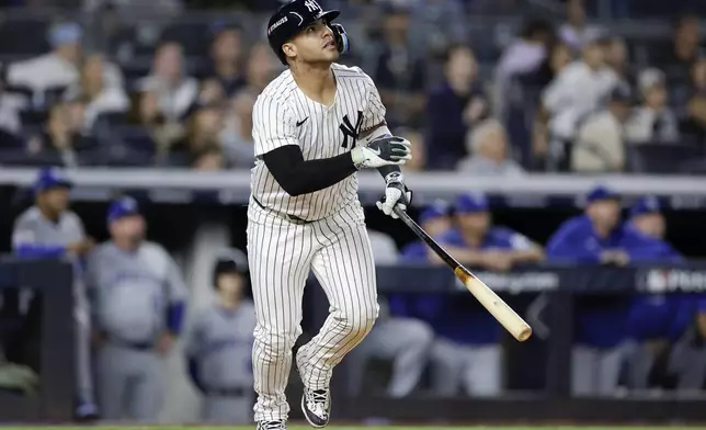 New York Yankees' Gleyber Torres reacts after hitting a two-run home run against the Kansas City Royals during the third inning Game 1 of the American League baseball division series, Saturday, Oct. 5, 2024, in New York. (AP Photo/Adam Hunger)