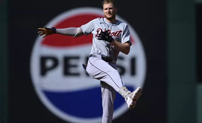 Detroit Tigers' Parker Meadows celebrates at second base after hitting a double in the second inning during Game 5 of baseball's American League Division Series against the Cleveland Guardians, Saturday, Oct. 12, 2024, in Cleveland. (AP Photo/David Dermer)