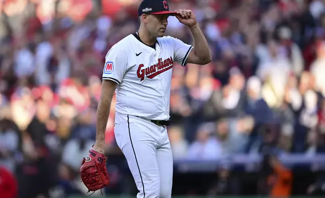 Cleveland Guardians starting pitcher Matthew Boyd tips his cap to the crowd as he walks off the field after being taken out of the game in the fifth inning during Game 2 of baseball's AL Division Series against the Detroit Tigers, Monday, Oct. 7, 2024, in Cleveland. (AP Photo/David Dermer)