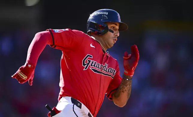 Cleveland Guardians' Brayan Rocchio runs to second base with a double in the eighth inning during Game 1 of baseball's AL Division Series against the Detroit Tigers, Saturday, Oct. 5, 2024, in Cleveland. (AP Photo/David Dermer)