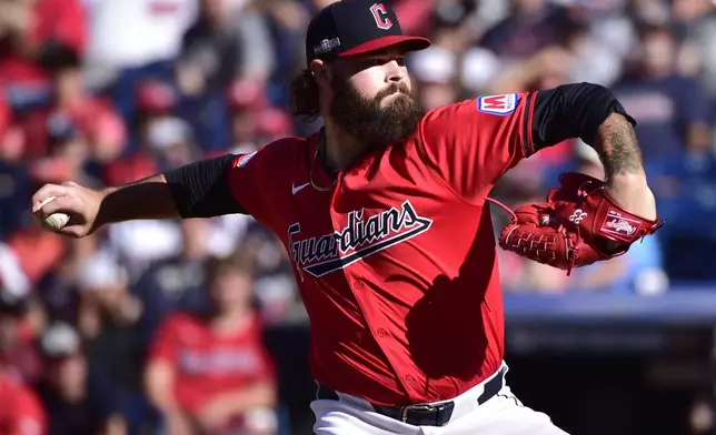 Cleveland Guardians' Hunter Gaddis pitches in the eighth inning during Game 1 of baseball's AL Division Series against the Detroit Tigers, Saturday, Oct. 5, 2024, in Cleveland. (AP Photo/Phil Long)