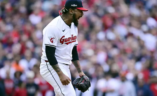 Cleveland Guardians' Emmanuel Clase reacts after striking out Detroit Tigers' Kerry Carpenter to end the eighth inning during Game 5 of baseball's American League Division Series, Saturday, Oct. 12, 2024, in Cleveland. (AP Photo/David Dermer)