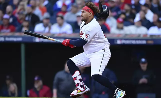 Cleveland Guardians' Josh Naylor doubles in the fifth inning during Game 2 of baseball's AL Division Series against the Detroit Tigers, Monday, Oct. 7, 2024, in Cleveland. (AP Photo/David Dermer)