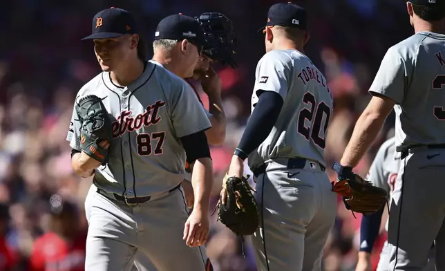 Detroit Tigers relief pitcher Tyler Holton (87) is taken out of the game in the first inning during Game 1 of baseball's AL Division Series against the Cleveland Guardians, Saturday, Oct. 5, 2024, in Cleveland. (AP Photo/David Dermer)