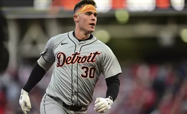 Detroit Tigers' Kerry Carpenter runs the bases with a three-run home run in the ninth inning during Game 2 of baseball's AL Division Series against the Cleveland Guardians, Monday, Oct. 7, 2024, in Cleveland. (AP Photo/David Dermer)