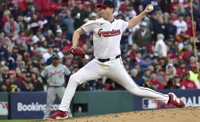 Cleveland Guardians' Tim Herrin pitches in the seventh inning during Game 2 of baseball's AL Division Series against the Detroit Tigers, Monday, Oct. 7, 2024, in Cleveland. (AP Photo/Phil Long)