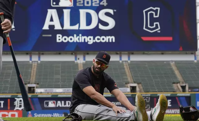 Detroit Tigers' Riley Greene stretches during a baseball workout in Cleveland, Friday, Oct. 4, 2024, in preparation for the American League Division Series against the Cleveland Guardians. (AP Photo/Sue Ogrocki)