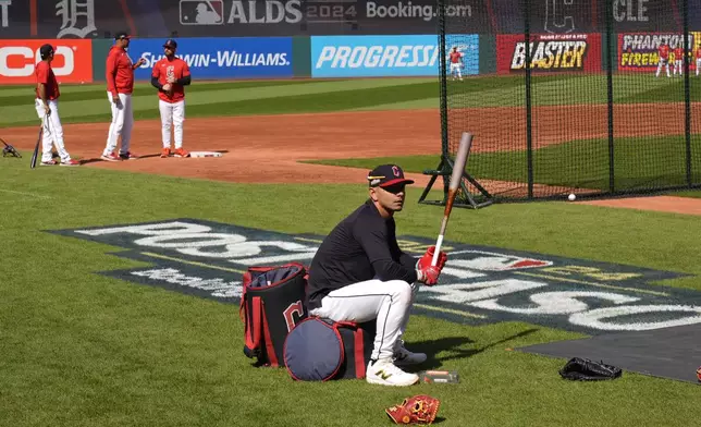 Cleveland Guardians' Andres Gimenez waits for his turn in the batting cage during a baseball workout in Cleveland, Friday, Oct. 4, 2024, in preparation for the American League Division Series against the Detroit Tigers. (AP Photo/Sue Ogrocki)