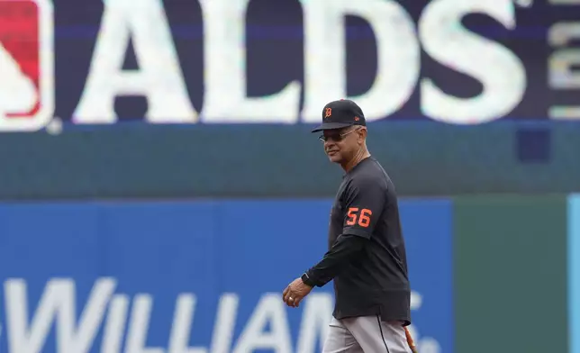 Detroit Tigers' Joey Cora walks on the field during a baseball workout in Cleveland, Friday, Oct. 4, 2024, in preparation for the American League Division Series against the Cleveland Guardians. (AP Photo/Sue Ogrocki)