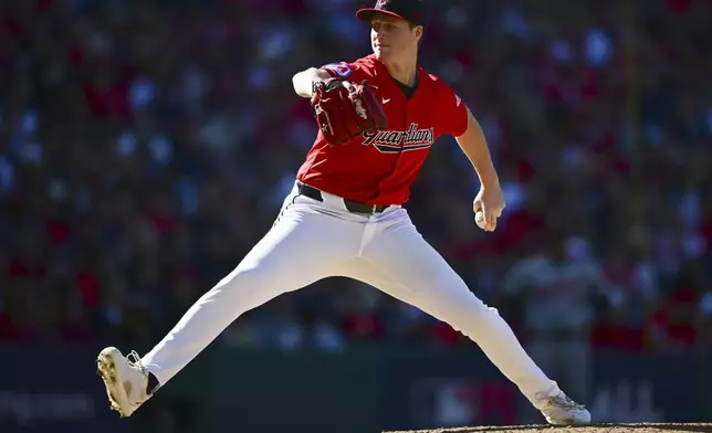 Cleveland Guardians' Tim Herrin pitches in the seventh inning during Game 1 of baseball's AL Division Series against the Detroit Tigers, Saturday, Oct. 5, 2024, in Cleveland. (AP Photo/David Dermer)