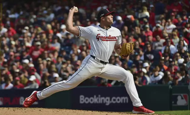 Cleveland Guardians' Cade Smith pitches in the third inning during Game 5 of baseball's American League Division Series against the Detroit Tigers, Saturday, Oct. 12, 2024, in Cleveland. (AP Photo/Phil Long)